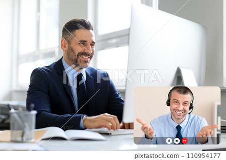 Business people two mature men have online meeting, office interior Business people two mature men have online meeting, office interior 110954177