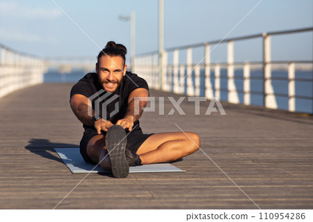 Happy Fit Man Doing Stretching Exercises Outside, Training On Pier 110954286