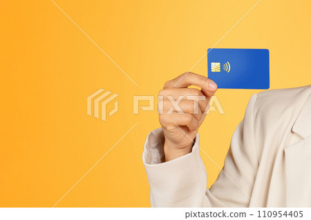Hand of young korean lady in suit show credit card, enjoy shopping 110954405