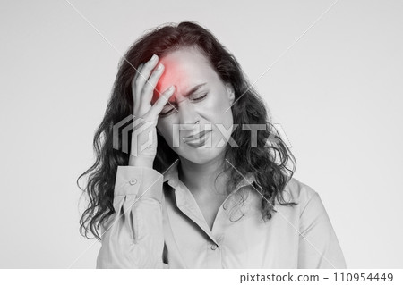 Sad millennial caucasian woman, with pained expression, suffer from red headache 110954449