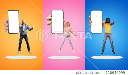 Smiling excited millennial, old european and black people show smartphone with empty screen 110954999