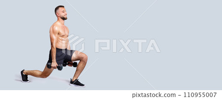 Positive sweat muscular millennial european man with beard, naked torso make exercises with dumbbells, lunges squats 110955007