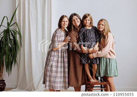 Four young girls in dresses of retro colors 110955055