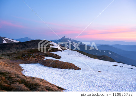 Morning in spring mountains with snow-capped hills 110955752