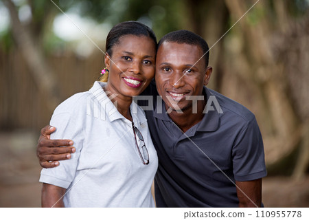 Happy couple embracing outdoors Happy couple embracing outdoors 110955778