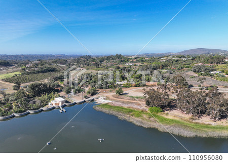 Aerial view over water reservoir and a large dam that holds water. Rancho Santa Fe in San Diego 110956080