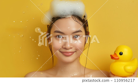 Young beautiful Asian woman washes her hair in the shower Young beautiful Asian woman washes her hair in the shower 110956217
