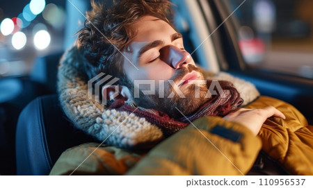 young man fell asleep at the wheel of a car 110956537