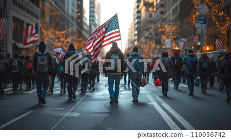 A group of people walk down the street with American flags 110956742