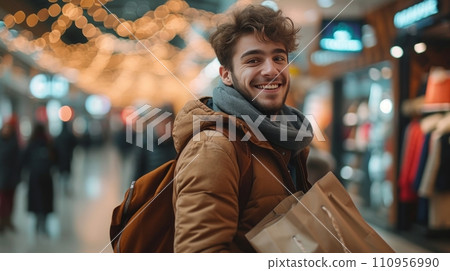 A Handsome Man Delights in Shopping for Gifts at the Mall 110956990