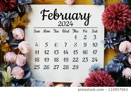 February 2024 monthly calendar with flower bouquet decoration  on yellow background 110957063