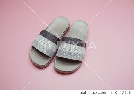 Gray slide sandal summer slippers on pink background 110957196