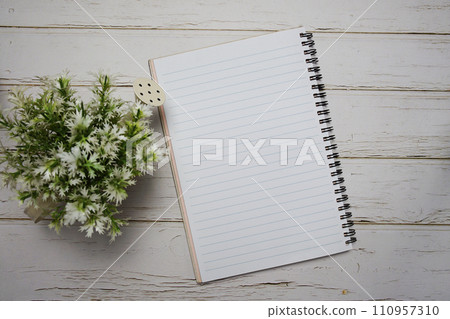 Top view of Empty Notebook open on wooden background 110957310