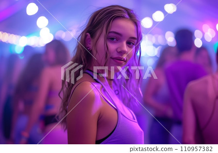a teenage girl in purple standing at a dance party a teenage girl in purple standing at a dance party 110957382