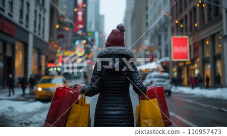A woman carries two heavy shopping bags through the streets of city A woman carries two heavy shopping bags through the streets of city 110957473
