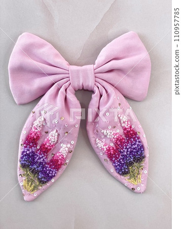 pink bow with embroidered delicate beautiful flowers in French knot technic 110957785