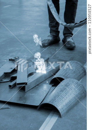 Laser cleaning of metal. The laser beam cleans the metal surface from rust. Laser removes removing old rust from metal. Innovation metalworking. New technologies Laser cleaning of metal. The laser beam cleans the metal surface from rust. Laser removes removing old rust from metal. Innovation metalworking. New technologies 110958527