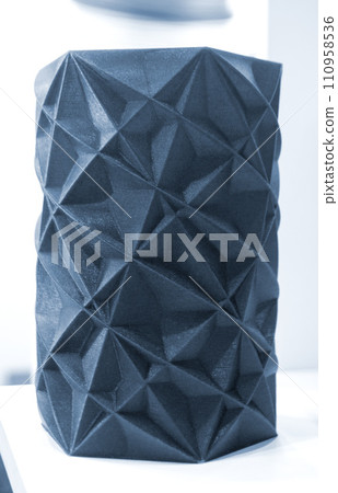 Art object vase printed on a 3D printer. Models created by a 3D printer from blue molten plastic. Concept 3d printing. Additive progressive technologies. New modern technology for creating objects 110958536
