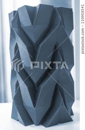 Art object vase printed on a 3D printer. Models created by a 3D printer from blue molten plastic. Concept 3d printing. Additive progressive technologies. New modern technology for creating objects 110958541