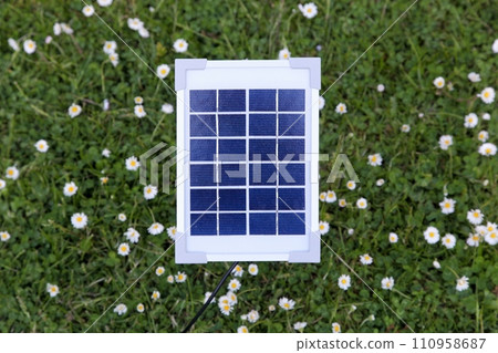 Small solar panel in a garden 110958687