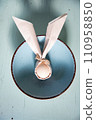 egg wrapped in easter bunny shaped napkin 110958850