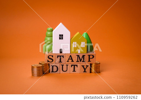 The inscription Stamp Duty made of wooden cubes on a plain background The inscription Stamp Duty made of wooden cubes on a plain background 110959262