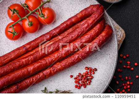 Delicious thin smoked hunting sausages with salt, spices and herbs 110959451
