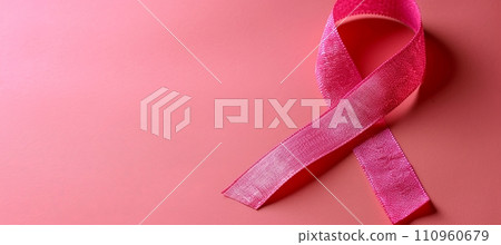 Breast cancer awareness month symbol with pink ribbon on pink background with copy space Breast cancer awareness month symbol with pink ribbon on pink background with copy space 110960679
