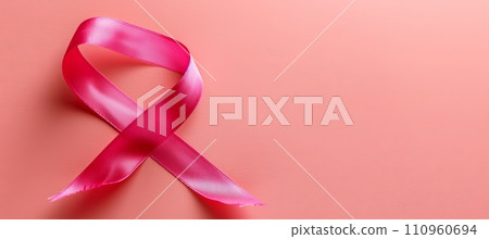 Breast cancer awareness month symbol pink ribbon isolated on pink background with copy space Breast cancer awareness month symbol pink ribbon isolated on pink background with copy space 110960694