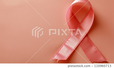 Breast cancer awareness month pink ribbon symbol isolated on pink background with copy space Breast cancer awareness month pink ribbon symbol isolated on pink background with copy space 110960713