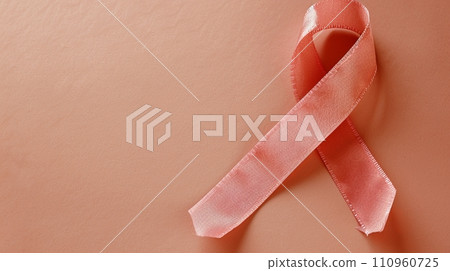 Breast cancer awareness month symbol pink ribbon on isolated pink background with copy space Breast cancer awareness month symbol pink ribbon on isolated pink background with copy space 110960725