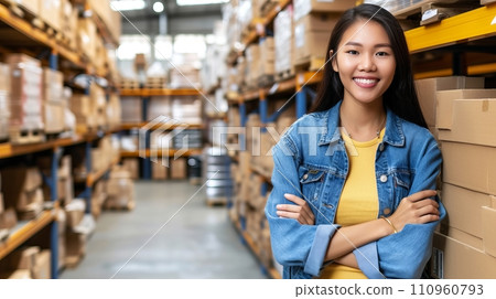 Portrait of female warehouse worker standing in large bright distribution center with ample lighting Portrait of female warehouse worker standing in large bright distribution center with ample lighting 110960793