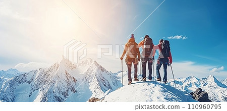 Friends climbing together, supporting each other as a team to reach the mountain summit. Friends climbing together, supporting each other as a team to reach the mountain summit. 110960795