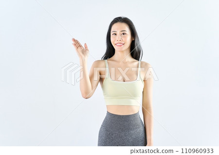 A woman wearing sportswear giving guidance A woman wearing sportswear giving guidance 110960933