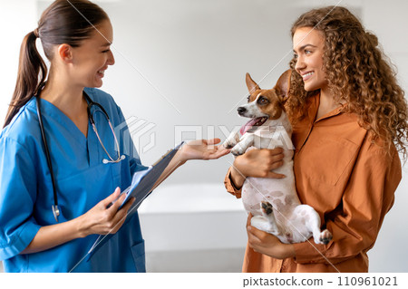 Vet clinic visit with dog and women Vet clinic visit with dog and women 110961021