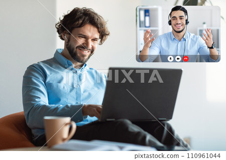 Cheerful Guy Looking At Screen Have Video Call With Colleague 110961044