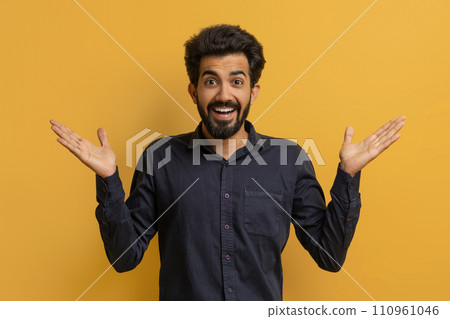 Portrait Of Surprised Young Indian Man Spreading Hands With Excitement Portrait Of Surprised Young Indian Man Spreading Hands With Excitement 110961046