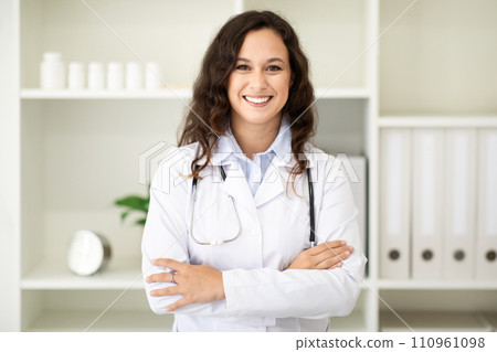Portrait of friendly smiling millennial woman doctor Portrait of friendly smiling millennial woman doctor 110961098