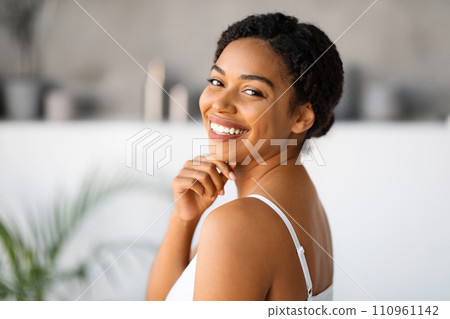 Natural Beauty. Attractive Black Woman Touching Chin And Looking At Camera 110961142