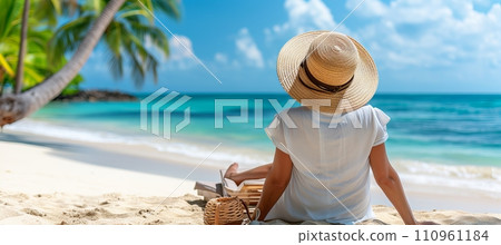 Happy woman enjoying summer beach vacation, relaxing by the seaside with palm trees and sandy beach 110961184
