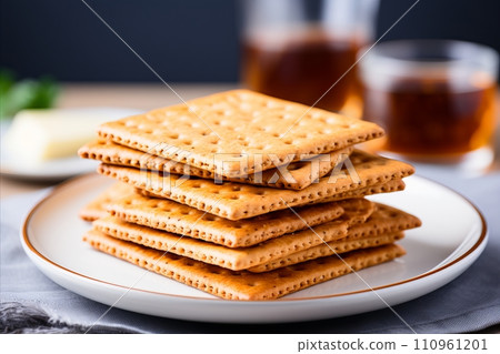 Assorted crispy crackers arranged on white background for versatile snack or appetizer option. Assorted crispy crackers arranged on white background for versatile snack or appetizer option. 110961201