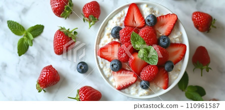 Wholesome oatmeal porridge with berries on white table   ideal for a healthy breakfast. 110961587