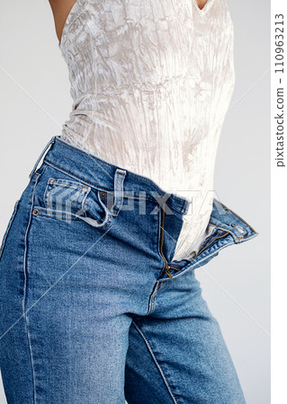 Woman with jeans. Anonymus lady dressing up. 110963213