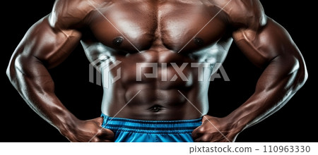 Muscular athlete in sportswear, black background with text spacefitness and gymnastics concept. 110963330
