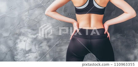 Female athlete with muscular waist in sportswear fitness and gymnastics concept Female athlete with muscular waist in sportswear fitness and gymnastics concept 110963355