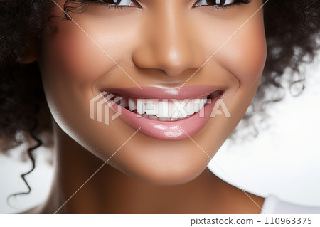Radiant smile of beautiful black woman with perfect white teeth on solid bright white background 110963375
