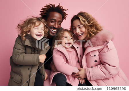 Happy black man, white woman, and kids jumping on bright pastel studio background Happy black man, white woman, and kids jumping on bright pastel studio background 110963398