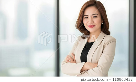 Happy businesswoman in modern office meeting room with copy space on blurred glass walls background Happy businesswoman in modern office meeting room with copy space on blurred glass walls background 110963432