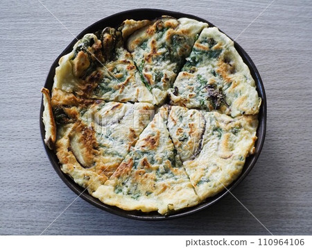 Homemade pancake with shiitake mushrooms and arugula Homemade pancake with shiitake mushrooms and arugula 110964106
