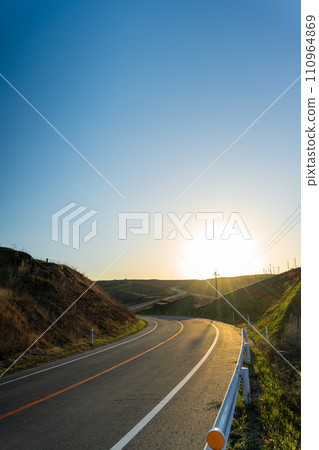 Aso Milk Road, a sightseeing spot that shines in the evening light, ``Aso Daikanbo area'' 110964869